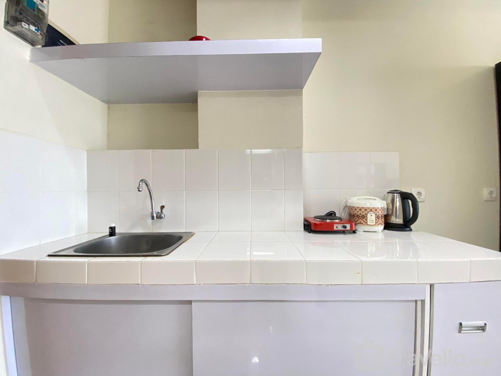 Cozy At Beverly Dago By Travelio Apartemen